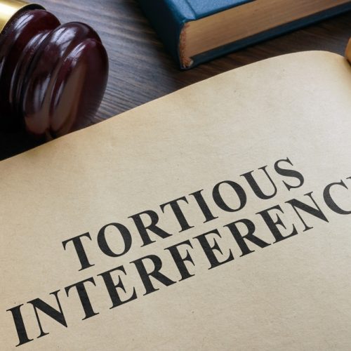 Open,Book,And,Gavel.,Tortious,Interference,Concept.