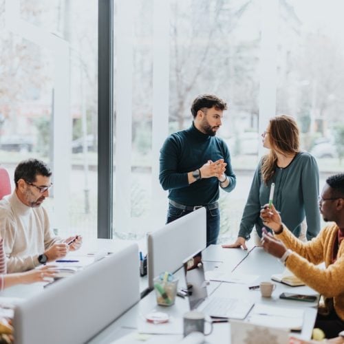 A,Group,Of,Professionals,Collaborating,And,Working,Together,In,A