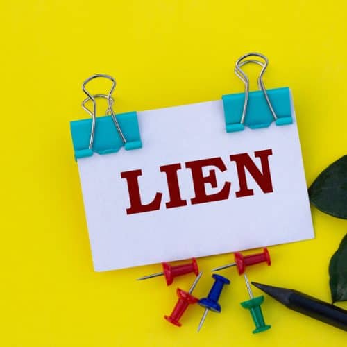 Lien, ,Word,On,A,White,Sheet,With,Clips,On