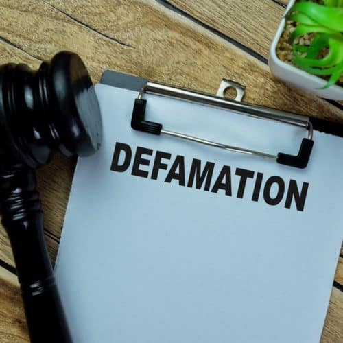 Concept,Of,Defamation,Write,On,Paperwork,With,Gavel,Isolated,On