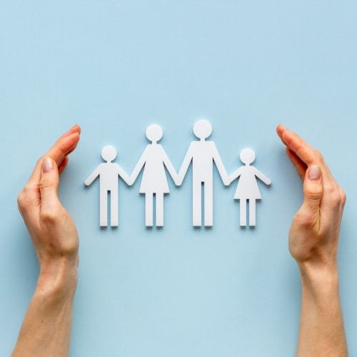 Hands,Holding,Family,Figure,Top,View.,Insurance,Concept