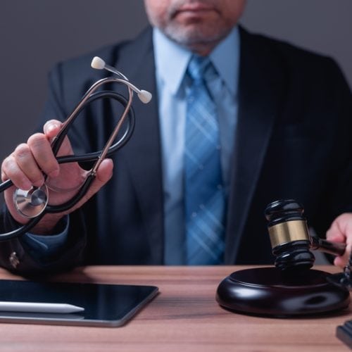 In,Courtroom,,The,Lawyer,Argues,For,Justice,,Presenting,Evidence,To