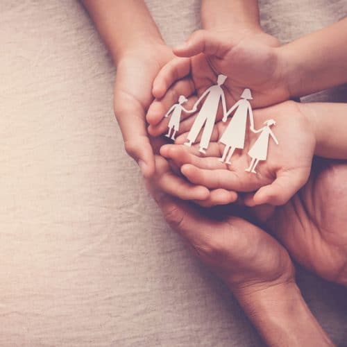 Hands,Holding,Paper,Family,Cutout,,Family,Home,,Foster,Care,,World