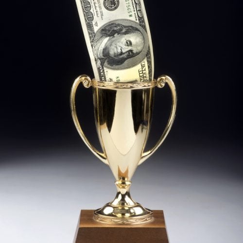 American,Money,Winner,In,A,Gold,Trophy.