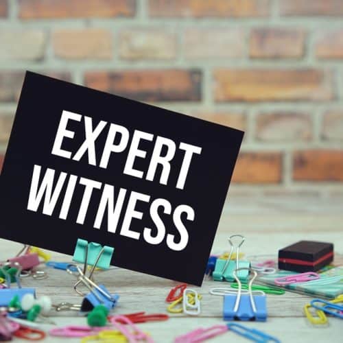 Expert,Witness,Text,On,Paper,Card,With,Stationary,On,Wooden