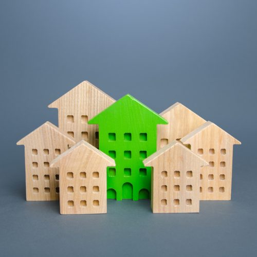 The,Green,Building,Stands,Out,Among,The,Houses.,Environmentally,Friendly,