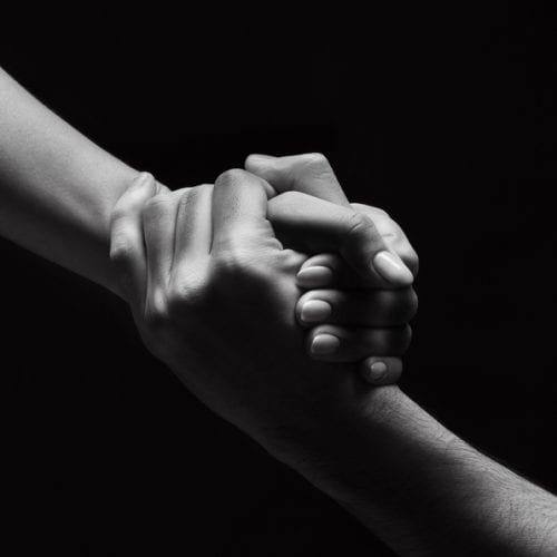Unrecognizable,Woman,Hand,Helping,Man,To,Stand,Up