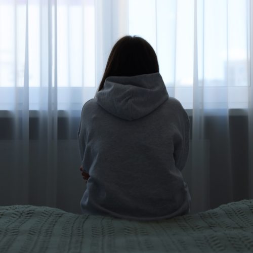 Loneliness,Concept.,Sad,Woman,Sitting,On,Bed,At,Home