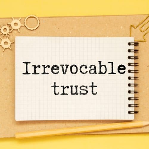 Irrevocable,Trust,Text,On,Sticker,With,Pen,On,The,Black