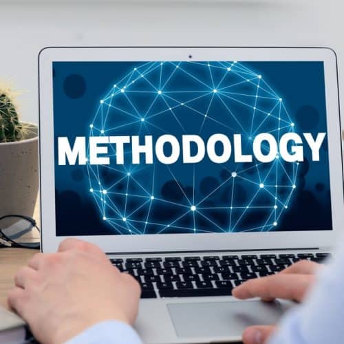 Methodology,Concept.,Man,Using,Modern,Laptop,At,Table,Indoors,,Closeup