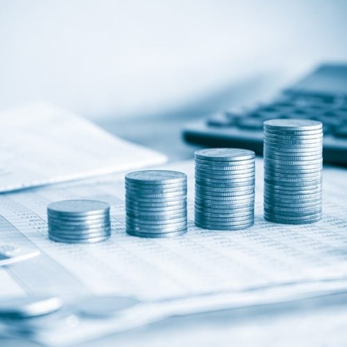 Stack,Of,Money,Coin,On,Accounting,Sheet,,Pen,And,Credit