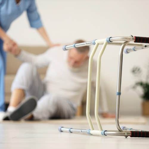 Walker,Against,Nurse,Helping,Senior,Man,To,Stand,Up,After
