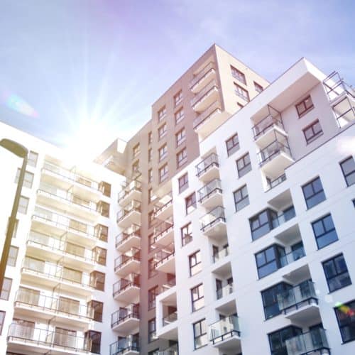 Modern,Apartment,Buildings,On,A,Sunny,Day,With,A,Blue