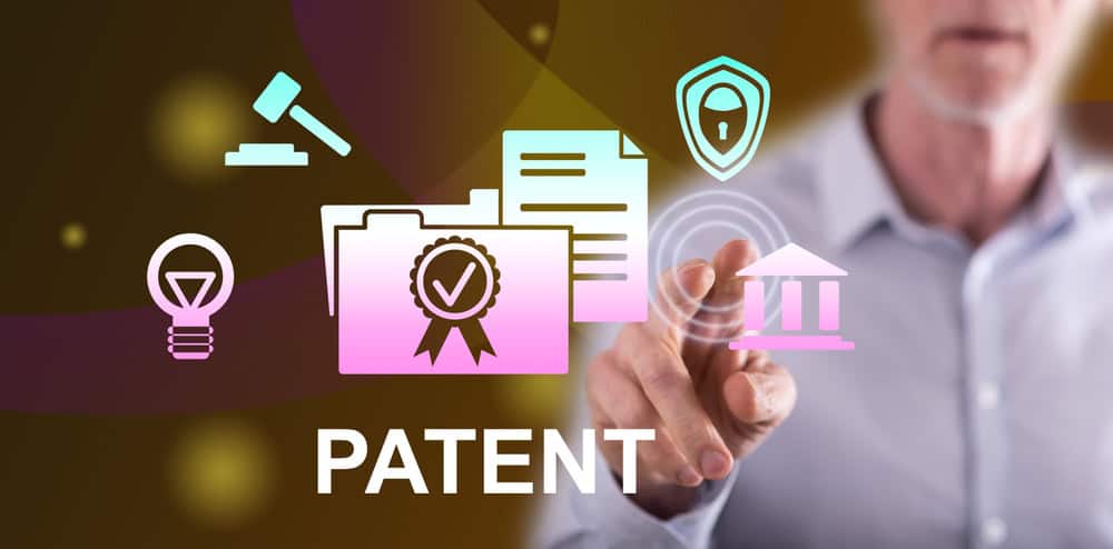 Man,Touching,A,Patent,Concept,On,A,Touch,Screen,With