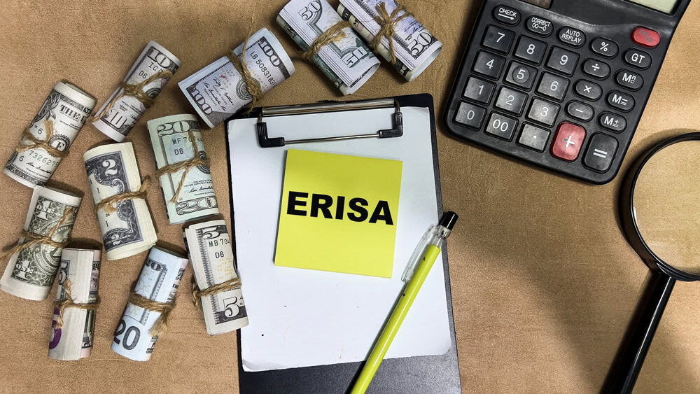 Concept,Of,Erisa,Write,On,Sticky,Notes,Isolated,On,Wooden