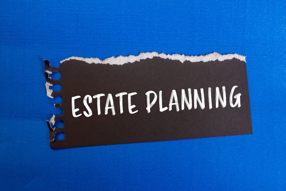 Estate,Planning,Message,Written,On,Ripped,Black,Paper,Piece,With