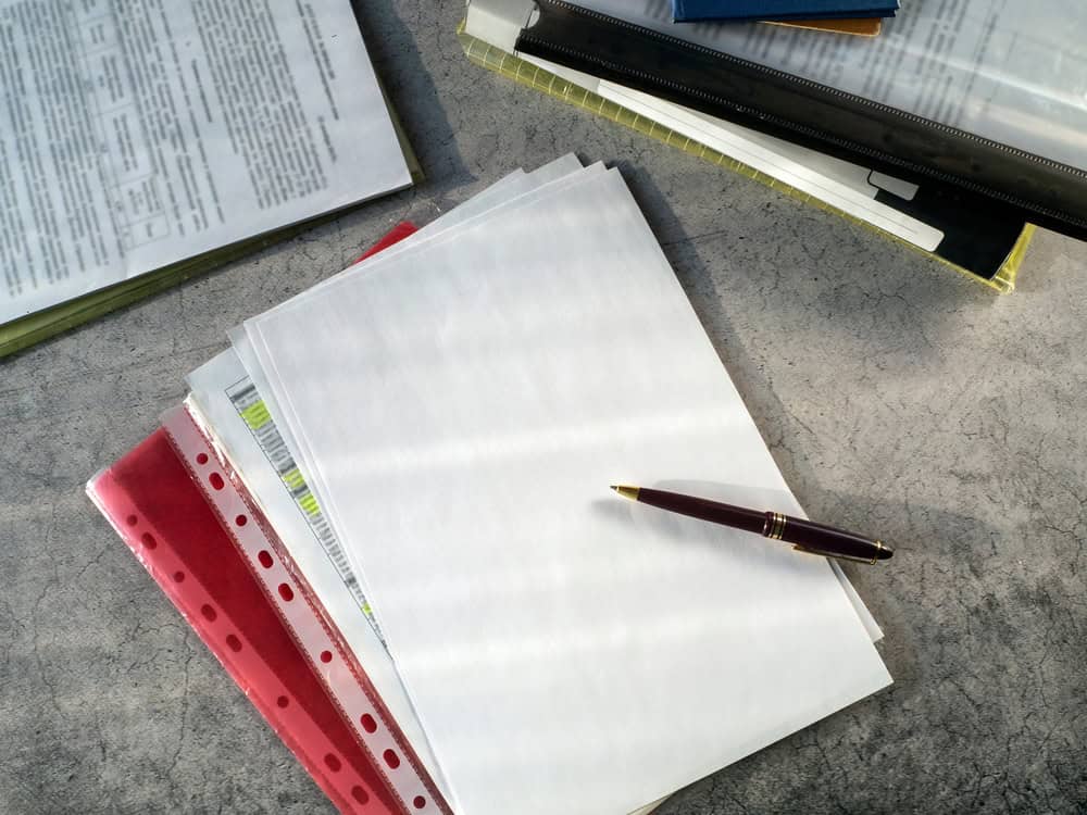 Documents,In,Folders,,Blank,Sheets,Of,Paper,,A,Pen,Are