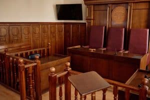 Corner,Of,Courtroom,With,Wooden,Desks,And,Railings,And,Leather